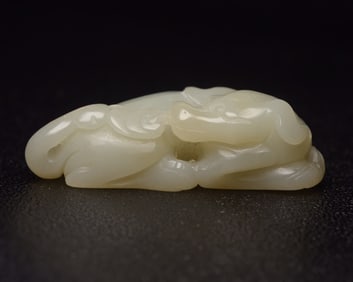 An Exquisite White Jade Dog Pendant