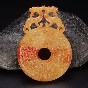 An Exquisite White Jade Dragon Pendant