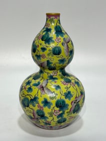A Rare Yellow Ground Famille-Rose Melon and Fruit Pattern Gourd-Shaped Vase