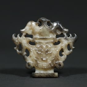 An Exquisite White Jade Beast-Face Pattern Pendant