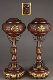 A pair of Gilt Red Copper Hatstands