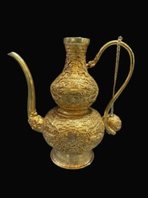 A Rare Gilt Bronze Relief Gourd-Shaped Ewer