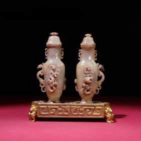 A pair of Rare White Jade Chi Dragon Vases with Gilt Silver Base