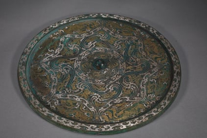 A Rare Han Dynasty Bronze Inlaid with Gold and Silver Dragon and Phoenix Pattern Mirror