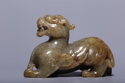 A Rare Gaogu Jade Auspicious Beast Handheld