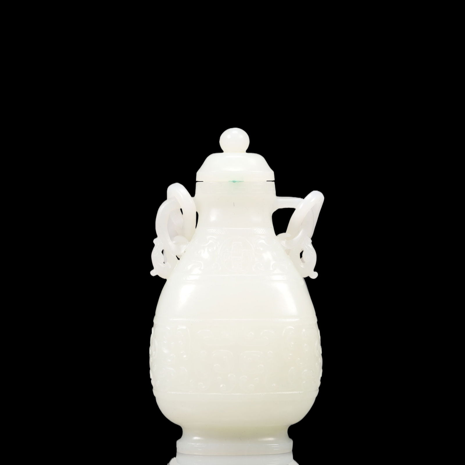 An Exquisite White Jade Beast-Face Pattern Double-Ears Ewer: An Exquisite White Jade Beast-Face Pattern Double-Ears Ewer, Qing Dynasty, China, Size:5.5cmx3.5cmx18cm, Weight:202g 精美的白玉兽面纹双耳