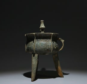 An Archaic Bronze Beast-Face Pattern Double-Ears and Tripod Libation Cup
