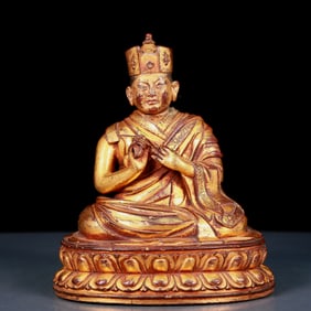 An exquisite gilt bronze statue of Guru