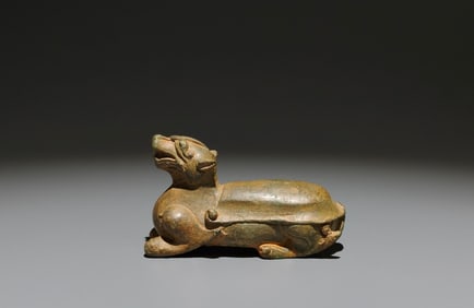 An Archaic Bronze Auspicious Beast Ornament