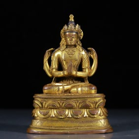 A Solemn Gilt Bronze Statue of Four-Armed Guanyin