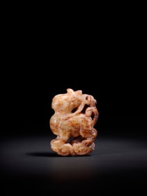 A Rare Hotan Jade Auspicious Beast-Shaped Handheld Ornament
