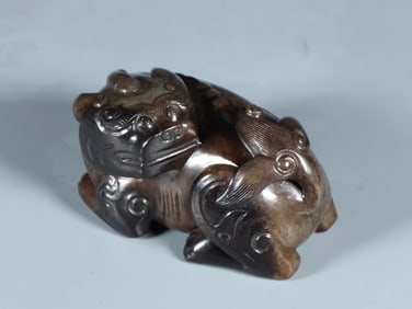 A Rare Gaogu Jade Auspicious Beast