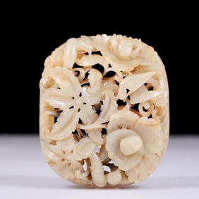 An exquisite white jade belt buckle with flower and bird patterns