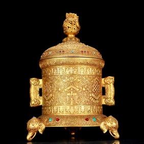 A stunning gilt bronze jar with double ears and dragon pattern