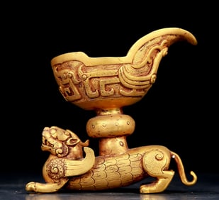 An exquisite gilt bronze cup with auspicious animal patterns