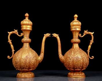 A pair of exquisite gilt bronze dragon-patterned ewers