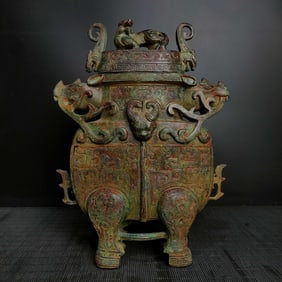 An Exquisite Bronze Beast-Face Pattern Double-Ears and Tripod Vase
