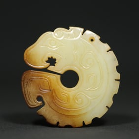 An Exquisite White Jade Dragon Pendant