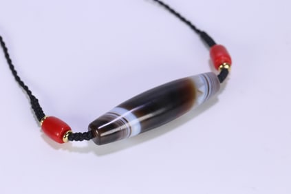 An Exquisite Agate Dzi Bead Pendant