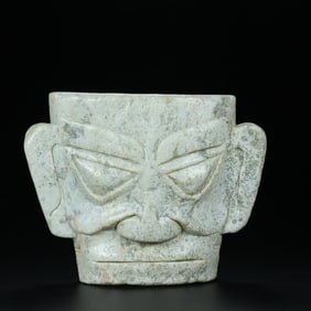 An Exquisite White Jade Mask Ornament