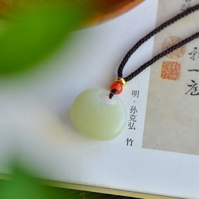 An Exquisite Greenish Jade Pendant
