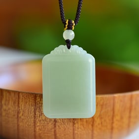 An Exquisite Greenish Jade Pendant