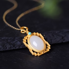 An Exquisite Sterling Silver-Gold Plated Inlaid White Jade Pendant