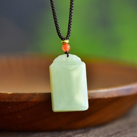 An Exquisite Greenish Jade Pendant