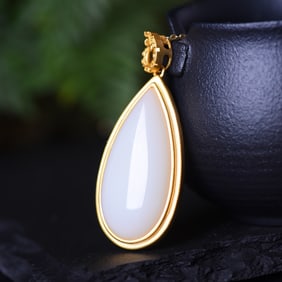 An Exquisite Sterling Silver-Gold Plated Inlaid White Jade Pendant