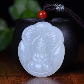 An Exquisite White Jade Avalokitesvara and Snake Pattern Pendant