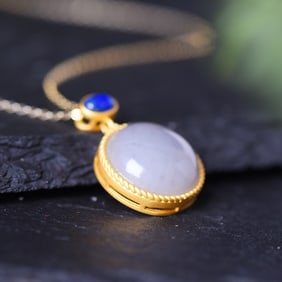 An Exquisite Sterling Silver-Gold Plated Inlaid White Jade Pendant