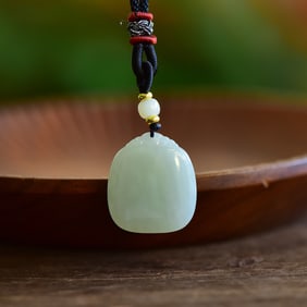 An Exquisite White Jade Pendant
