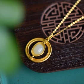 An Exquisite Sterling Silver-Gold Plated Inlaid White Jade Pendant