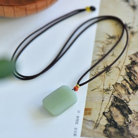 An Exquisite Greenish Jade Pendant