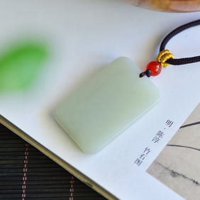 An Exquisite White Jade Pendant