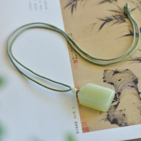 An Exquisite White Jade Pendant