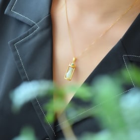 An Exquisite Sterling Silver-Gold Plated Inlaid White Jade Pendant