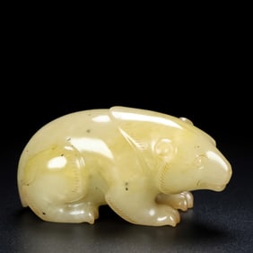 An Archaic White Jade Bear Ornament