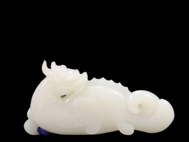 An Exquisite White Jade Dragon Pendant