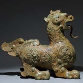 An Archaic Bronze Auspicious Beast Ornament,with Inscription