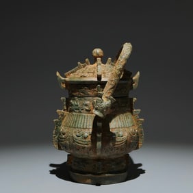 An Archaic Bronze Phoenix Pattern Loop-handled Pot