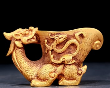 An exquisite gilt bronze cup with dragon pattern