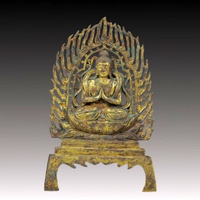 A Solemn Gilt Bronze Buddha
