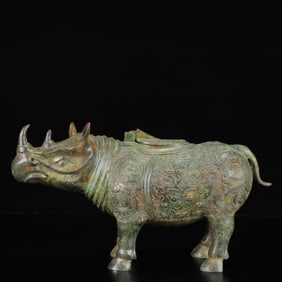 An Archaic Bronze Beast-Face Pattern Rhinoceros Ornament