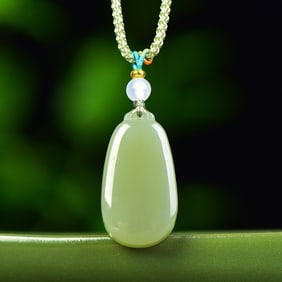 An Exquisite Greenish Jade Pendant