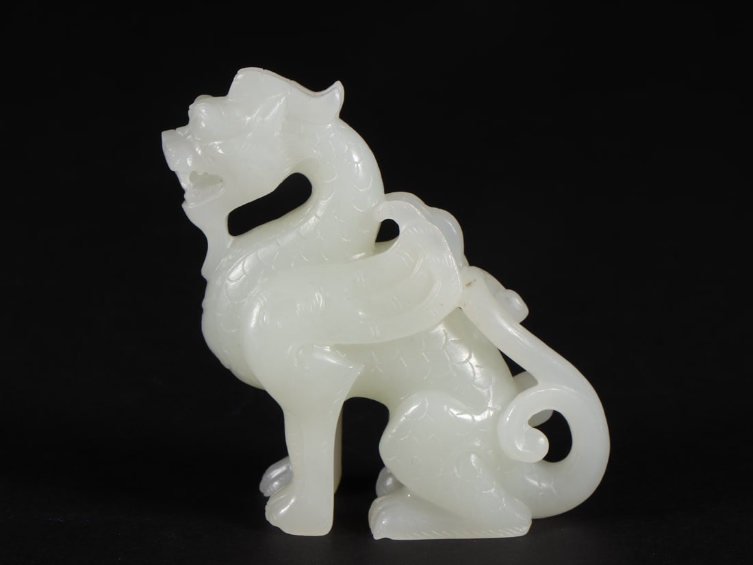 An Exquisite White Jade Kylin Ornament: An Exquisite White Jade Kylin Ornament Qing Dynasty, China Size:2.1inx0.9inx2.4in Weight:68g白玉麒麟 中国清代 Size:5.4cmx2.3cmx6.1cm Weight:68g