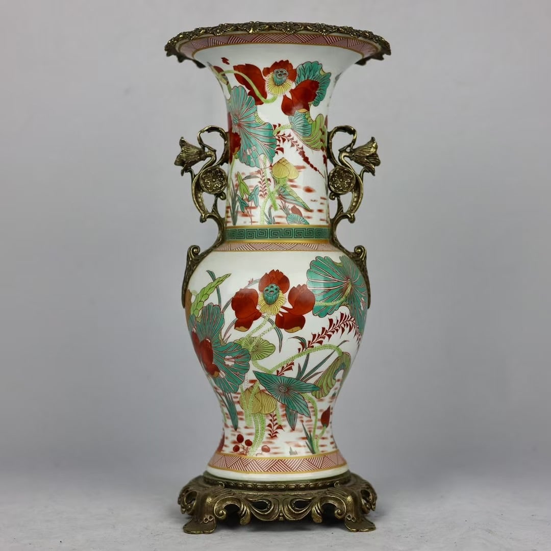 An Exquisite Famille-Rose Inlaid Bronze Flower Pattern Double-Ears Vase: An Exquisite Famille-Rose Inlaid Bronze Flower Pattern Double-Ears Vase Qing Dynasty, China Qianlong Four-character Mark Size:15.7inx7.9in粉彩荷花镶铜花๟