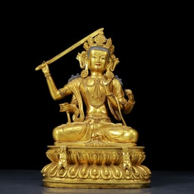 A Solemn Gilt Bronze Statue of Four-Armed Manjusri