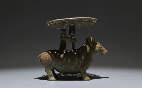 An Archaic Bronze Buffalo-Shaped Candlestick
