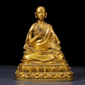 A Solemn Gilt Bronze Statue of Guru